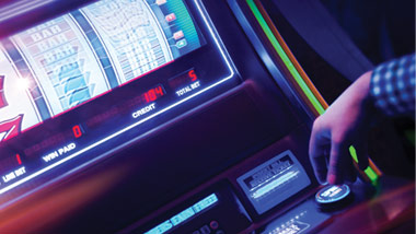 pushing a button on a slot machine